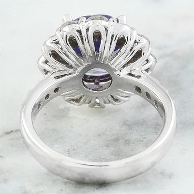 Juweliere schlagen 1/4 Akzent Sterling Silver Ring des Karat-T.G.W. Tanzanite And White CZ mit einer Keule