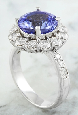 Juweliere schlagen 1/4 Akzent Sterling Silver Ring des Karat-T.G.W. Tanzanite And White CZ mit einer Keule